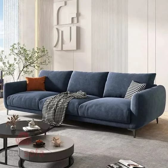 Grey L-shaped sofa placed in a small modern living room