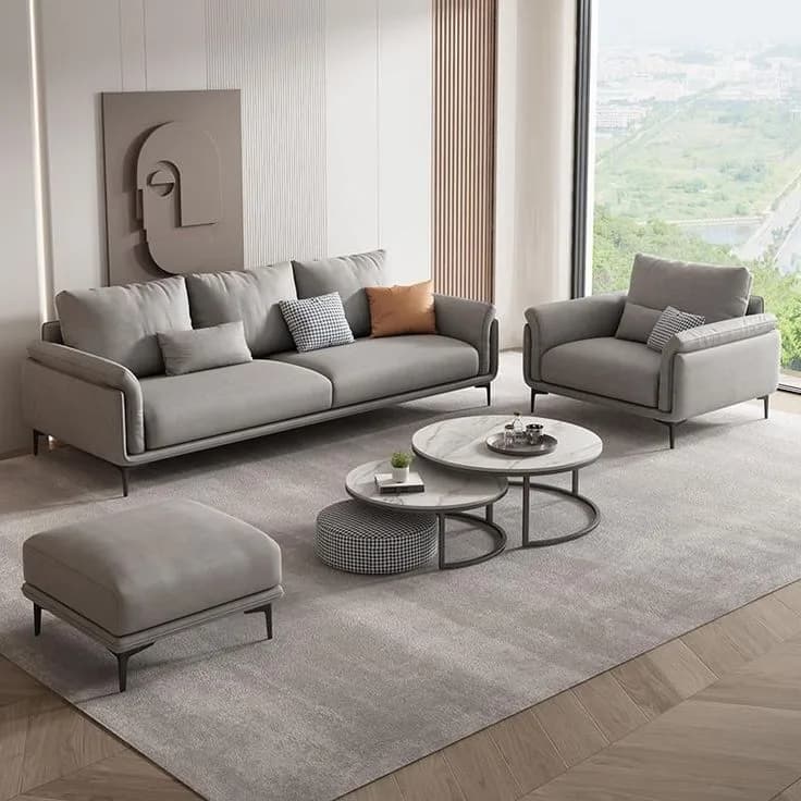 Brown leather Chesterfield sofa with tufted design in a spacious hall